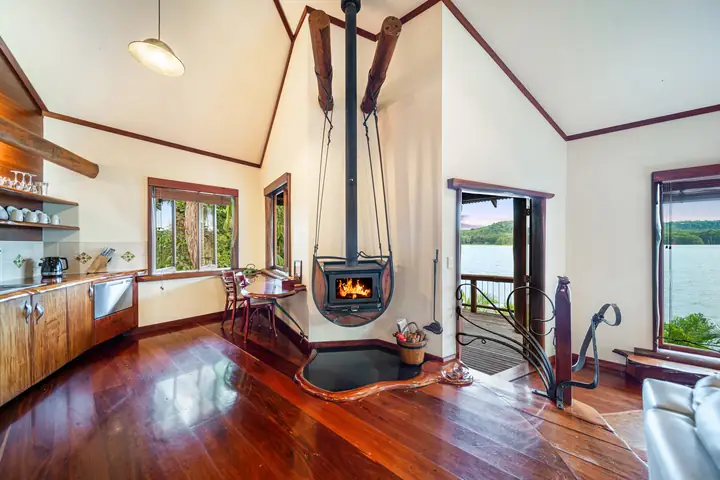 Dragonfly penthouse with a hanging fireplace and lake views