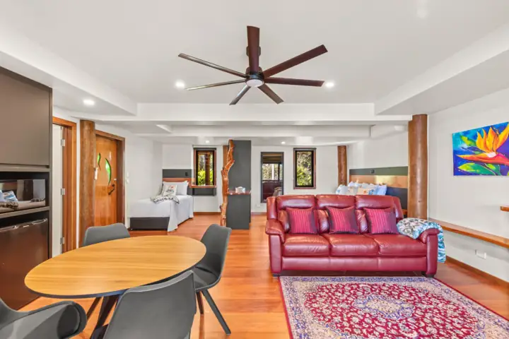 Moonlight studio apartment with dining table, lounge and king bed