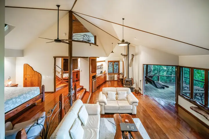 Wait a While penthouse with handcrafted timber furniture and carvings